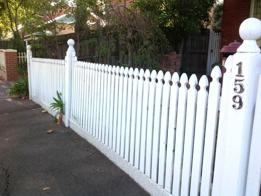 The old white picket fence with the 159 house number